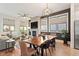 Bright living room with a fireplace, dining space, and hardwood floors at 610 Velma Hopkins Ln, Raleigh, NC 27603