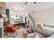 Spacious open-concept living area with dining space, stairs and modern décor at 610 Velma Hopkins Ln, Raleigh, NC 27603