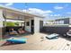 Open rooftop deck with an outdoor seating area, cornhole game, and string lights at 610 Velma Hopkins Ln, Raleigh, NC 27603