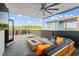 Open rooftop deck with an outdoor seating area, string lights, and a fire pit at 610 Velma Hopkins Ln, Raleigh, NC 27603