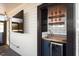 Rooftop wet bar featuring a mini-fridge, wine glasses, and a sink at 610 Velma Hopkins Ln, Raleigh, NC 27603