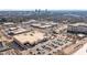 Wide aerial shot of a shopping center featuring extensive parking and multiple retail buildings at 618 N Boylan Ave # 810, Raleigh, NC 27603