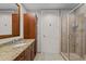 Bathroom features a vanity with granite countertop, wood cabinets and a tiled shower at 618 N Boylan Ave # 810, Raleigh, NC 27603