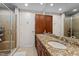 Bathroom features double sinks, granite countertops, wood cabinets, and tiled floors at 618 N Boylan Ave # 810, Raleigh, NC 27603