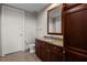 Well-maintained bathroom featuring a vanity with granite countertop, a toilet, and a large mirror at 618 N Boylan Ave # 810, Raleigh, NC 27603