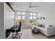 Cozy bedroom setup with a murphy bed, workspace, comfortable seating, and ample natural light at 618 N Boylan Ave # 810, Raleigh, NC 27603