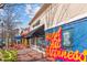 Exterior of businesses featuring hand-painted advertisements and outdoor seating at 618 N Boylan Ave # 810, Raleigh, NC 27603