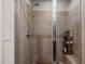 Walk-in shower features a handheld sprayer and shower head with tiled walls and a glass enclosure at 618 N Boylan Ave # 810, Raleigh, NC 27603