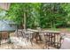 Spacious back deck with outdoor seating, perfect for enjoying the serene wooded backyard at 628 Kankakee Ct, Knightdale, NC 27545