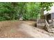 Expansive backyard featuring a shed, wooden deck, and mature trees providing ample shade and privacy at 628 Kankakee Ct, Knightdale, NC 27545