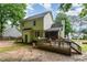 View of backyard with wood deck, screened porch, and lush surroundings providing great outdoor living space at 628 Kankakee Ct, Knightdale, NC 27545