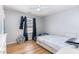 Cozy bedroom with light hardwood floors, ceiling fan and natural light, featuring a double bed and decor at 628 Kankakee Ct, Knightdale, NC 27545