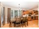 Inviting dining area with a large window, wooden table set, and hardwood floors at 628 Kankakee Ct, Knightdale, NC 27545