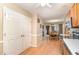 Open-concept kitchen with hardwood floors and views into the dining and living rooms at 628 Kankakee Ct, Knightdale, NC 27545