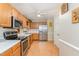 Functional kitchen featuring modern stainless steel appliances and ample counter space at 628 Kankakee Ct, Knightdale, NC 27545