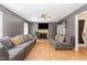 Spacious living room features hardwood floors, a fireplace, and two comfortable sofas at 628 Kankakee Ct, Knightdale, NC 27545
