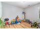 Fun playroom with hardwood floors, toys, a table, chair, and natural light from a window at 628 Kankakee Ct, Knightdale, NC 27545