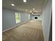 Spacious living room with neutral carpet and fireplace at 65 Prospect Church Rd, Erwin, NC 28339