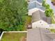 An aerial view shows a home's wooden deck and fenced-in lawn bordering tree line at , Knightdale, NC 27545