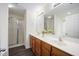 Bathroom features a double sink vanity, framed mirror and shower with sliding doors at , Knightdale, NC 27545