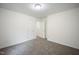 Bedroom featuring neutral walls, carpet flooring, and an interior door to another room at , Knightdale, NC 27545