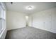 Bedroom featuring neutral walls, carpet flooring, and an interior door to another room at , Knightdale, NC 27545