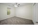 Bedroom featuring neutral walls, carpet flooring, ceiling fan, and a single window at , Knightdale, NC 27545