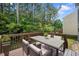 Outdoor deck with table and chairs surrounded by trees at , Knightdale, NC 27545