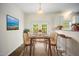 Dining area with a modern table, chairs, and a TV mounted on the wall at , Knightdale, NC 27545