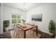 Formal dining room with hardwood table, seating for six, and natural light at , Knightdale, NC 27545