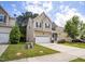 Inviting two-story home with front yard, long driveway, and attached two car garage at , Knightdale, NC 27545
