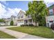 Charming two-story home featuring a manicured lawn, mature trees and inviting front porch at , Knightdale, NC 27545