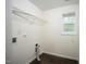 Cozy laundry room with vinyl flooring, window and shelving with dryer hookups at , Knightdale, NC 27545
