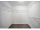 A walk-in closet has wire shelving for organizing clothes and accessories at , Knightdale, NC 27545