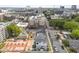 Elevated perspective of townhomes under construction, set against a backdrop of urban buildings and tree-lined streets at 710 W North St # 103, Raleigh, NC 27603