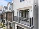 Private balcony with a seating area, offering an outdoor living space with a railing at 710 W North St # 103, Raleigh, NC 27603
