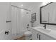 Bathroom features a shower and tub combination with a white vanity at 710 W North St # 103, Raleigh, NC 27603