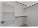 Walk-in closet with shelving and wood racks for organizing clothing and accessories at 710 W North St # 103, Raleigh, NC 27603