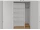 An empty closet with white shelving, providing storage options for a bedroom or other area at 710 W North St # 103, Raleigh, NC 27603