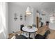Elegant dining space with stylish decor, a modern light fixture, and wine storage at 710 W North St # 103, Raleigh, NC 27603