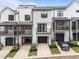 Modern townhomes feature a two car garage, balcony, and screened porch at 710 W North St # 103, Raleigh, NC 27603
