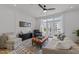 Inviting living room with modern furnishings, decorative accent wall, and patio access with balcony views at 710 W North St # 103, Raleigh, NC 27603