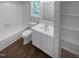 Bathroom featuring white vanity with ample counter space and storage at 720 Rawls Dr, Raleigh, NC 27610
