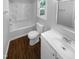 A clean bathroom featuring a shower-tub combination, a toilet, and a single-sink vanity with modern fixtures at 720 Rawls Dr, Raleigh, NC 27610