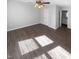 Bright bedroom with hardwood floors, ceiling fan, and en-suite bathroom at 720 Rawls Dr, Raleigh, NC 27610