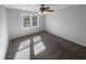 Cozy bedroom with neutral carpet and a ceiling fan for added comfort at 720 Rawls Dr, Raleigh, NC 27610