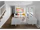 Bright, staged living room featuring modern furniture, hardwood floors, and a large window for plenty of natural light at 720 Rawls Dr, Raleigh, NC 27610