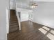 Expansive open-concept living area with hardwood floors, staircase, and balcony offering a view of the lower level at 720 Rawls Dr, Raleigh, NC 27610