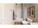 Neat bathroom featuring a shower-tub combo, decorative wall art, and a modern toilet, designed for comfort at 75 E American Marigold Dr # 37, Benson, NC 27504