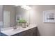 Bathroom featuring double sinks with modern fixtures, neutral color scheme, and bright lighting at 75 E American Marigold Dr # 37, Benson, NC 27504